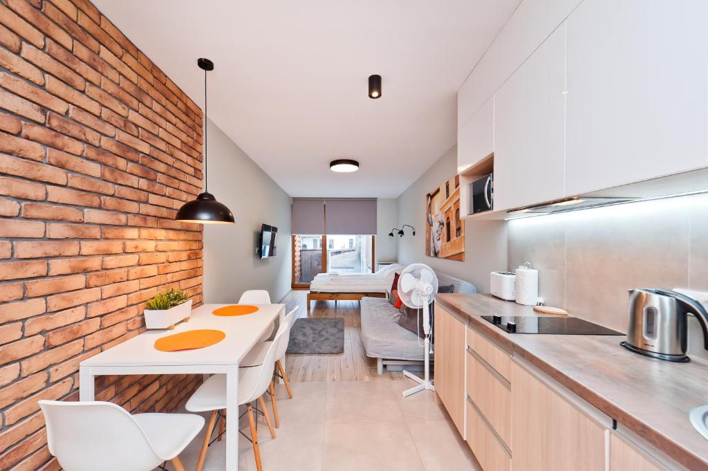 Kuchyňa alebo kuchynka v ubytovaní Olimp Apartments