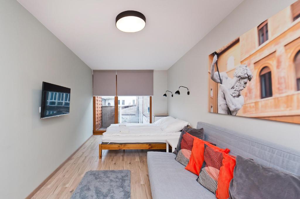 Televízia a/alebo spoločenská miestnosť v ubytovaní Olimp Apartments