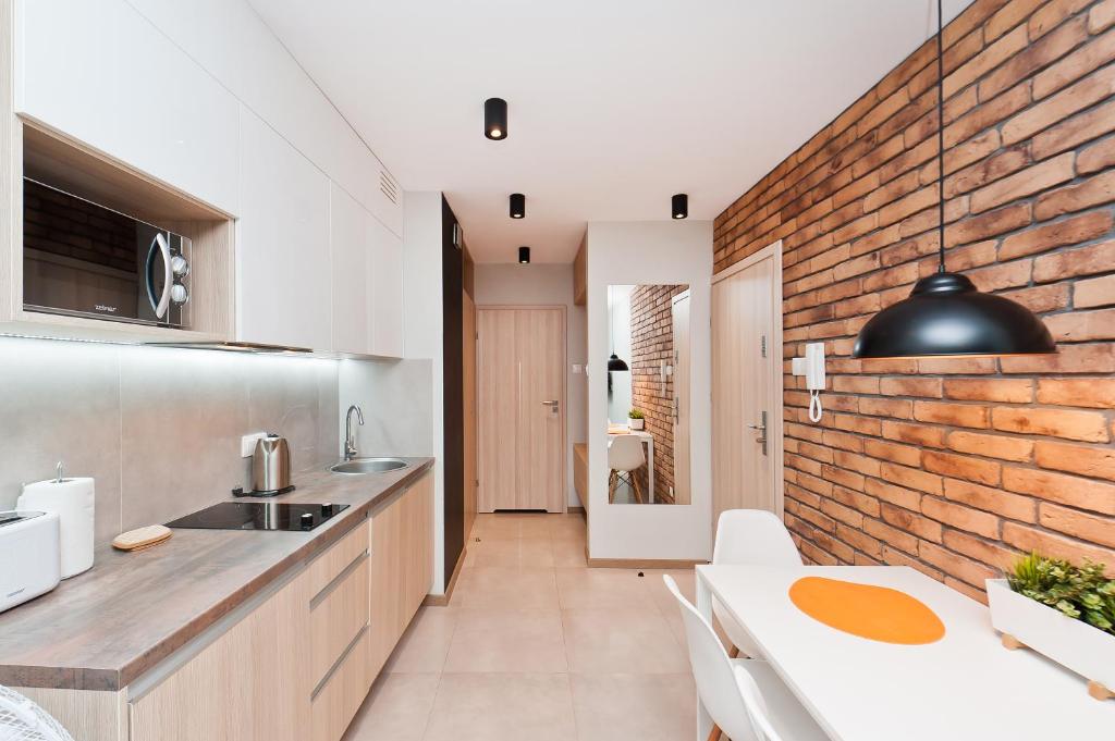 Kuchyňa alebo kuchynka v ubytovaní Olimp Apartments