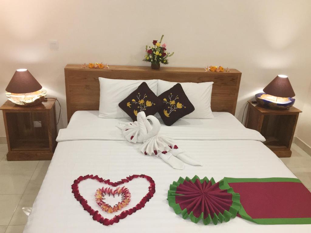 Postel nebo postele na pokoji v ubytování Bulan Bali Homestay