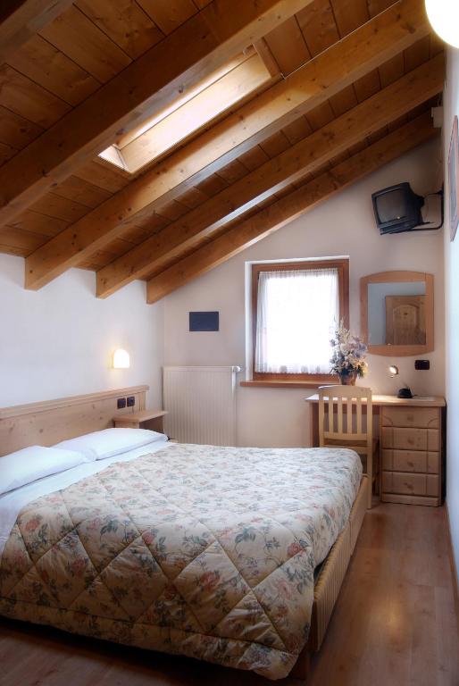 Postel nebo postele na pokoji v ubytování Albergo Ristorante Alle Codole