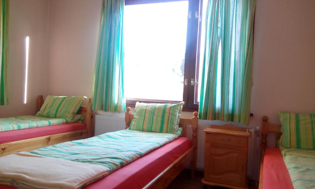 Postel nebo postele na pokoji v ubytování Guest House Lorian