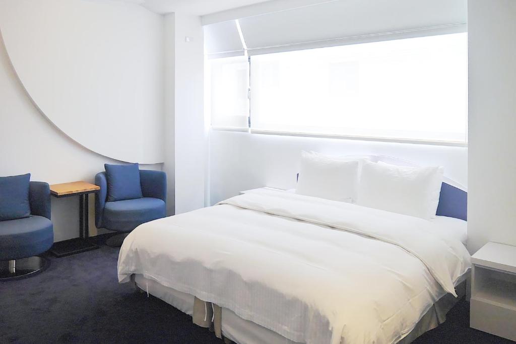 Katil atau katil-katil dalam bilik di Time Flyer Hotel