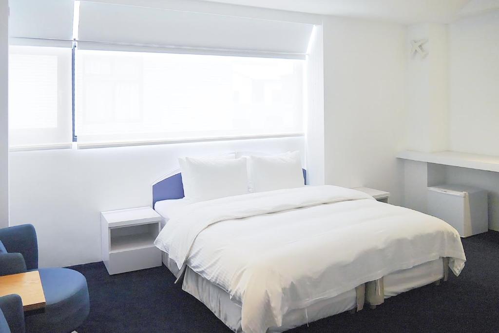 Katil atau katil-katil dalam bilik di Time Flyer Hotel