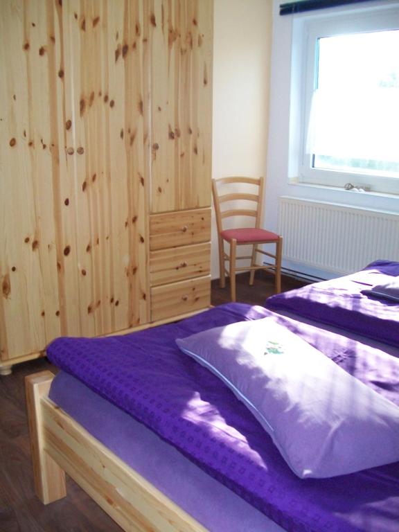 Ένα ή περισσότερα κρεβάτια σε δωμάτιο στο Haus Darmstadt