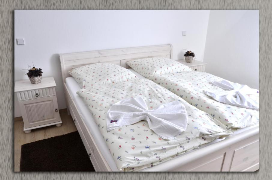 Postel nebo postele na pokoji v ubytování Café im Hof- Bed & Breakfast