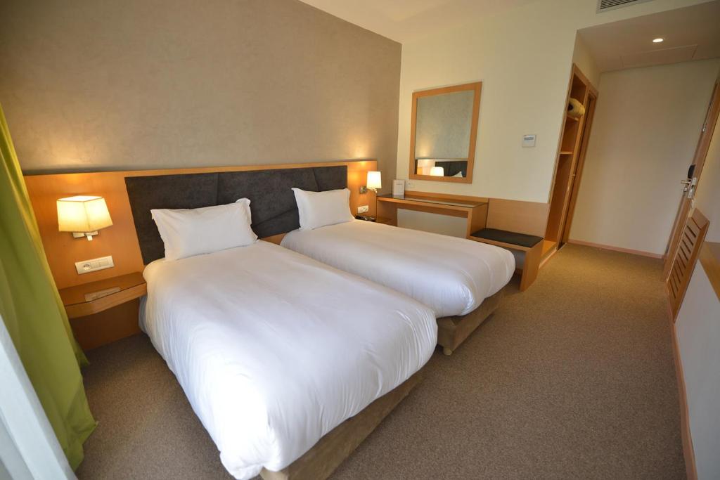 Postel nebo postele na pokoji v ubytování Annakhil Hotel
