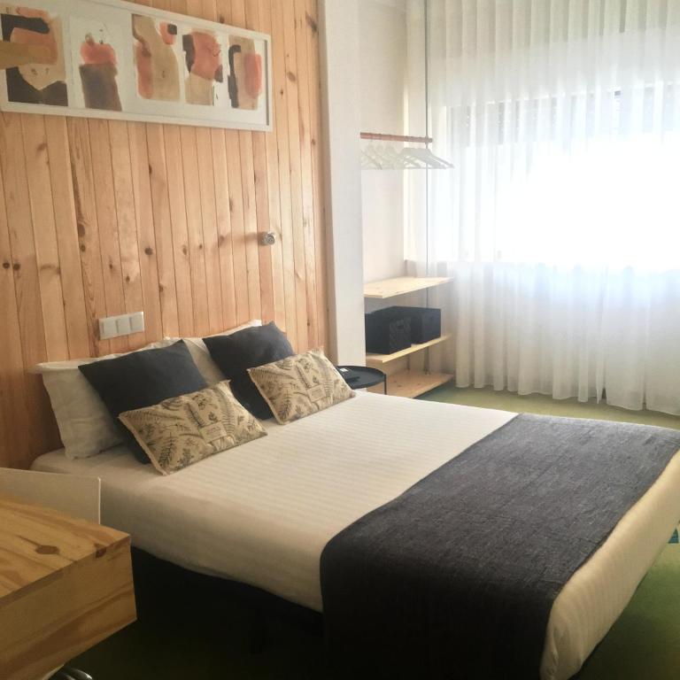 Uma cama ou camas num quarto em Hotel Umu
