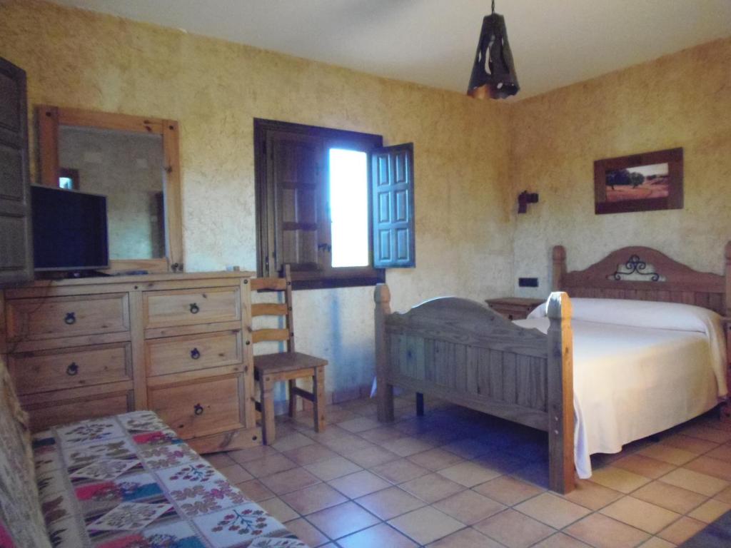 Postel nebo postele na pokoji v ubytování Cortijo Moyano