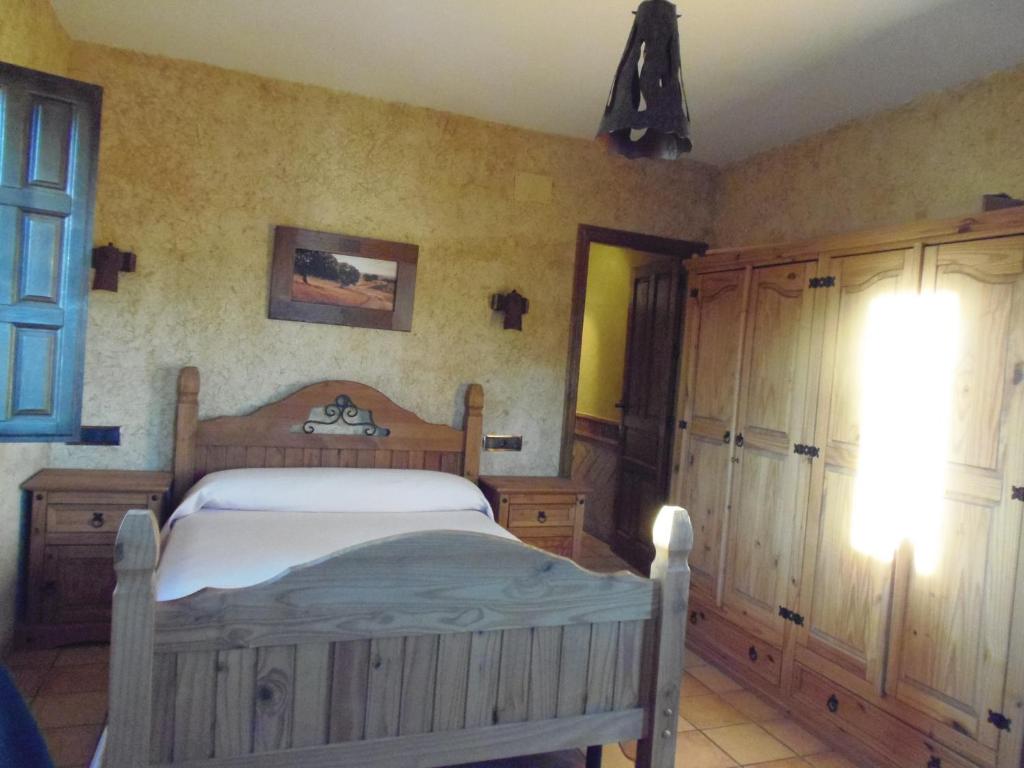 Postel nebo postele na pokoji v ubytování Cortijo Moyano