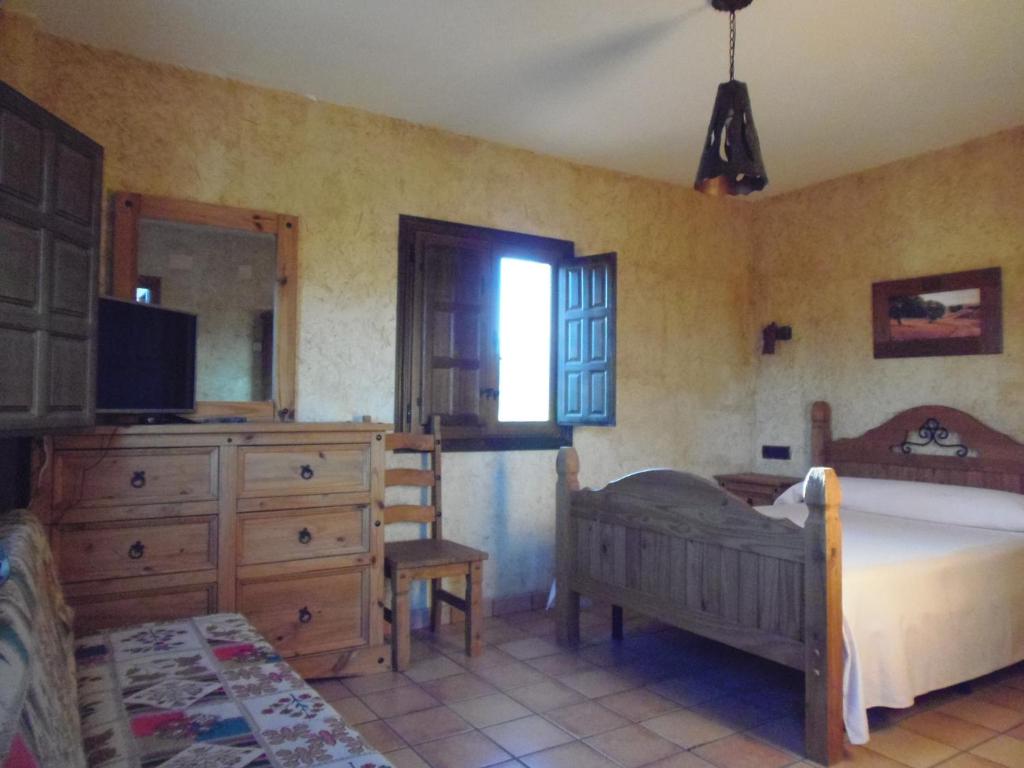 Postel nebo postele na pokoji v ubytování Cortijo Moyano