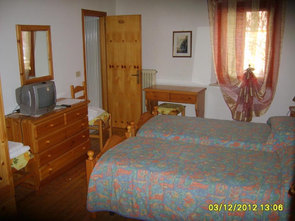 Postel nebo postele na pokoji v ubytování Antico Albergo Sant'Antonio