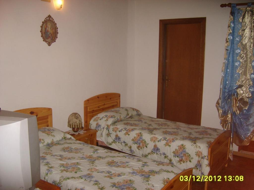 Postel nebo postele na pokoji v ubytování Antico Albergo Sant'Antonio