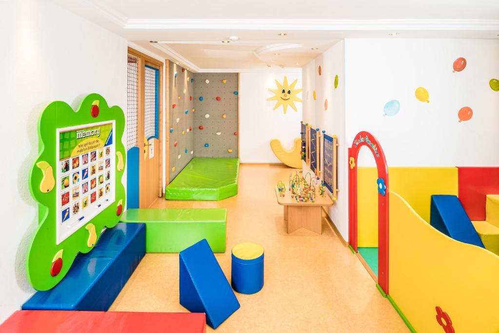 a childrens play room with a rock wall at Hotel Alpenroyal - The Leading Hotels of the World in Selva di Val Gardena