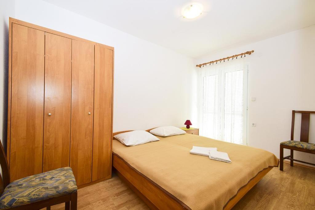 Postel nebo postele na pokoji v ubytování Guesthouse Dupin