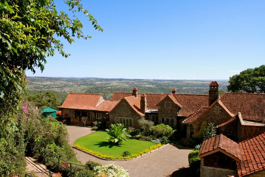 an aerial view of a house with a yard at The Aberdare Country Club in Mweiga