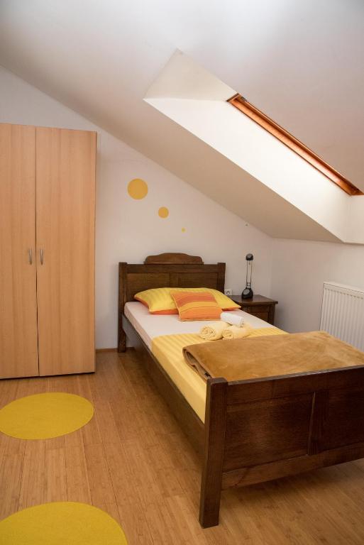 a bedroom with a bed and a skylight at Smještaj Slavonija in Daruvar