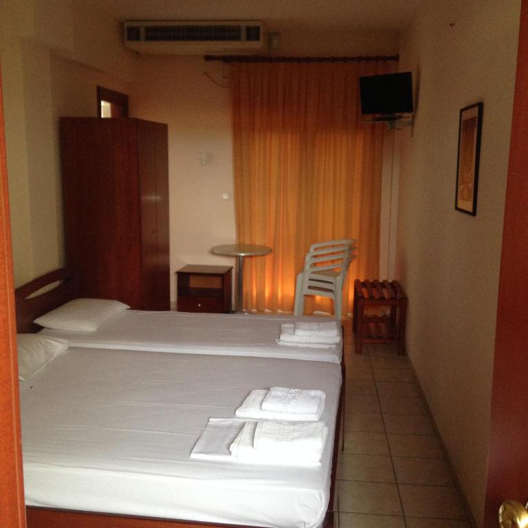 Postel nebo postele na pokoji v ubytování Hotel Akrogiali