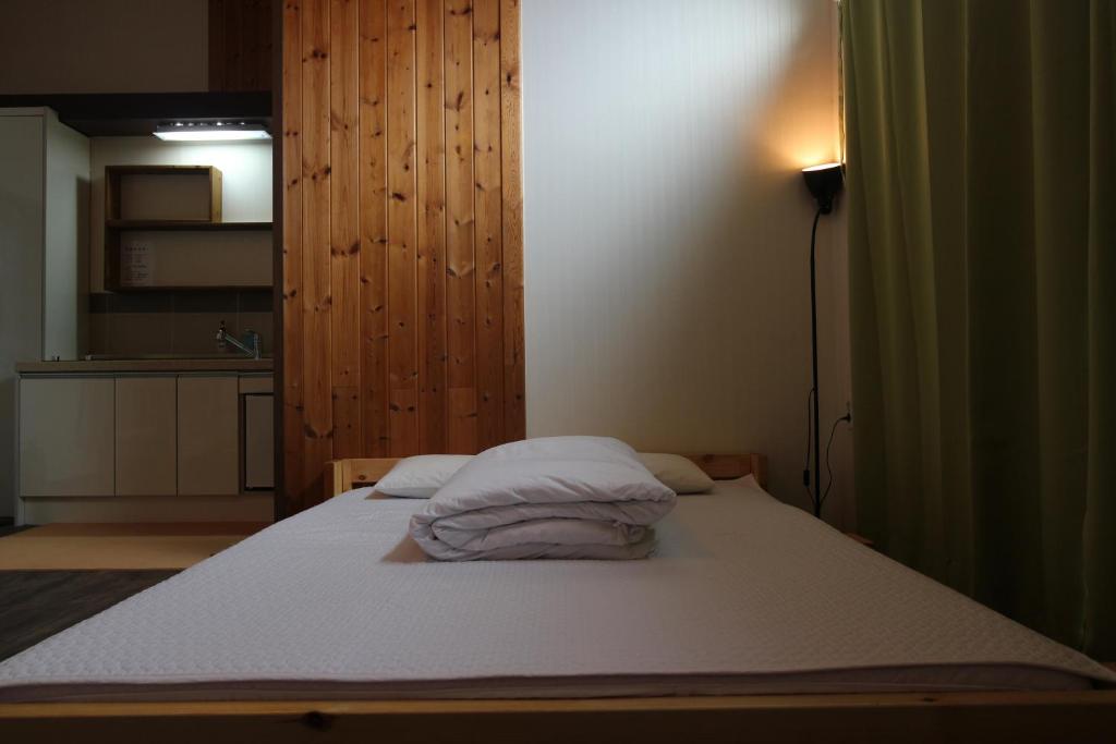 Postel nebo postele na pokoji v ubytování Guesthouse Kim's Cabin