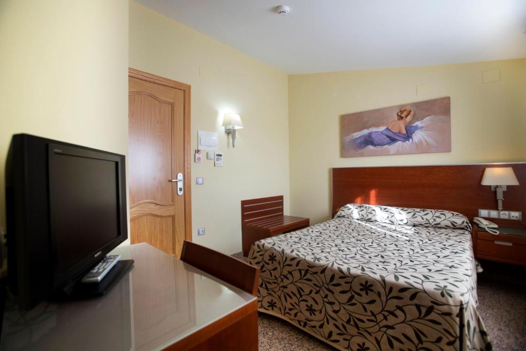 TV a/nebo společenská místnost v ubytování Hotel Marivella