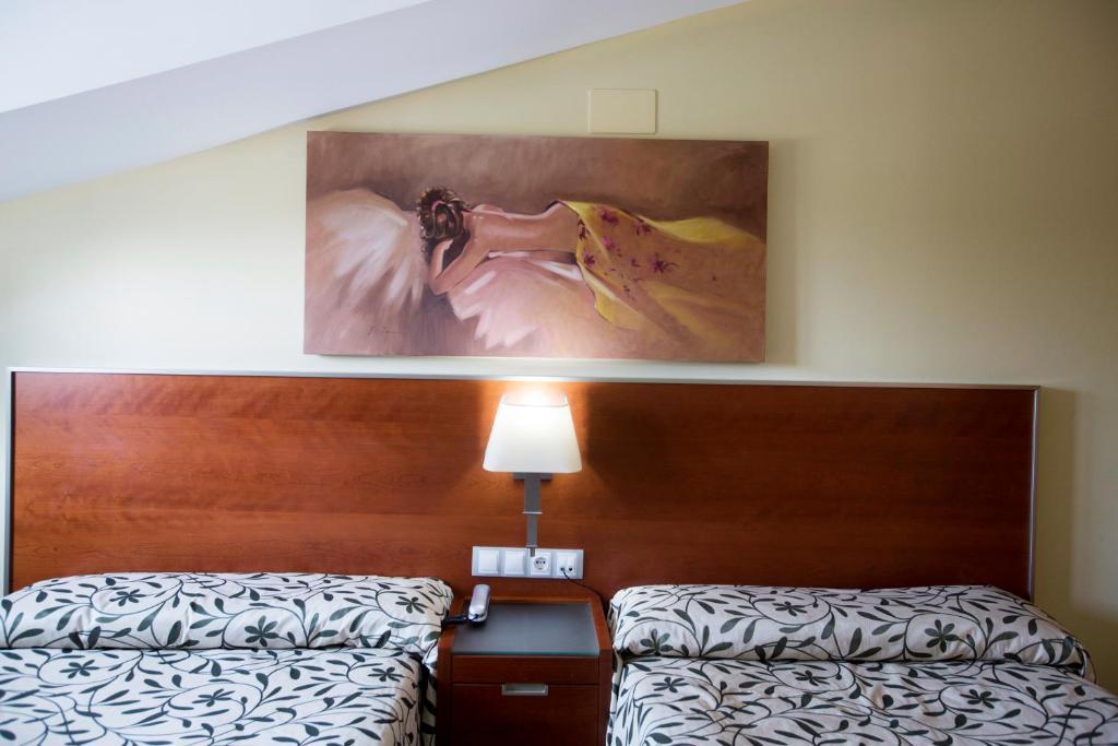 Postel nebo postele na pokoji v ubytování Hotel Marivella