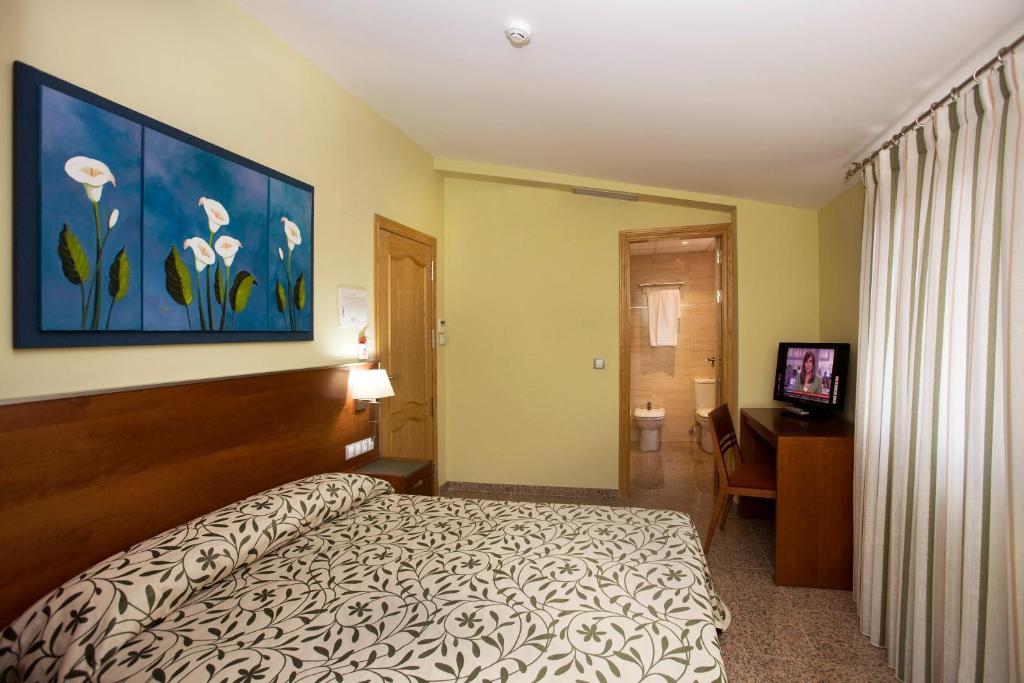 Postel nebo postele na pokoji v ubytování Hotel Marivella