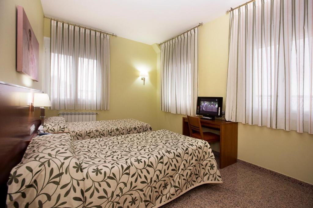 TV a/nebo společenská místnost v ubytování Hotel Marivella