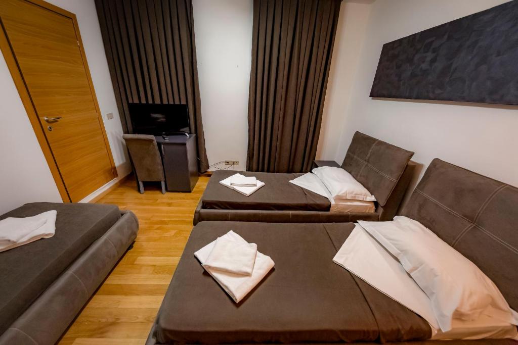 Postel nebo postele na pokoji v ubytování Hotel Trieste