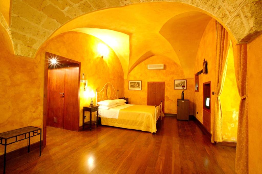 a bedroom with a bed in a large room at Nel Centro Storico in Galatina