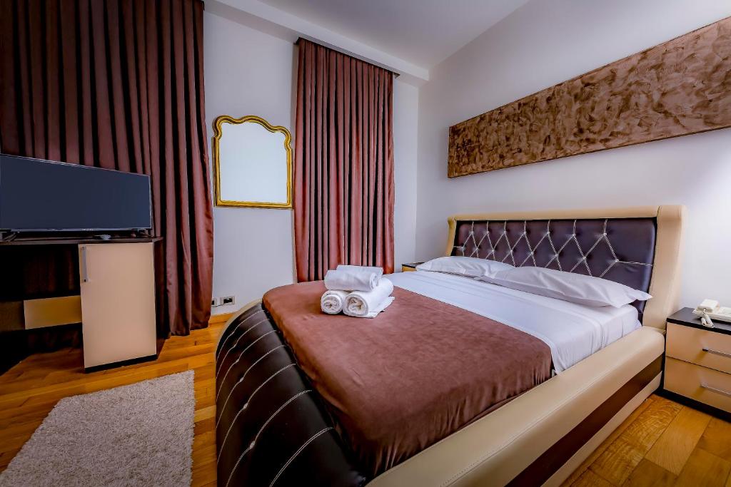 Postel nebo postele na pokoji v ubytování Hotel Trieste