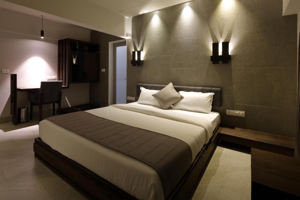 Postel nebo postele na pokoji v ubytování Hotel Carrefour