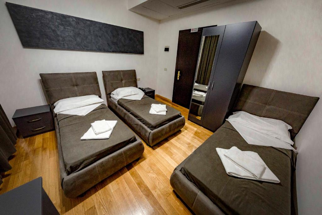 Postel nebo postele na pokoji v ubytování Hotel Trieste