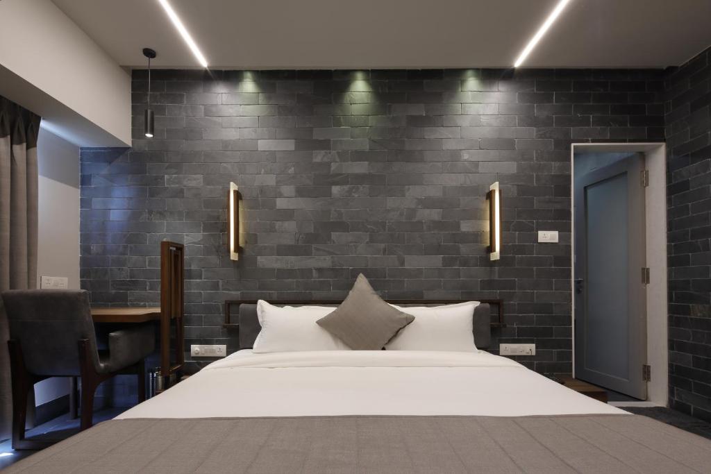 Postel nebo postele na pokoji v ubytování Hotel Carrefour