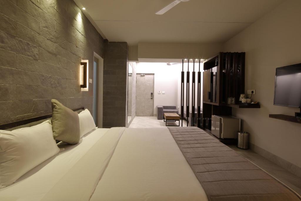 Postel nebo postele na pokoji v ubytování Hotel Carrefour