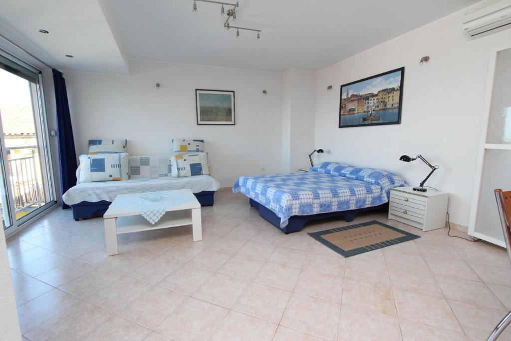 Ένα ή περισσότερα κρεβάτια σε δωμάτιο στο Rooms and Apartments Bella Vista