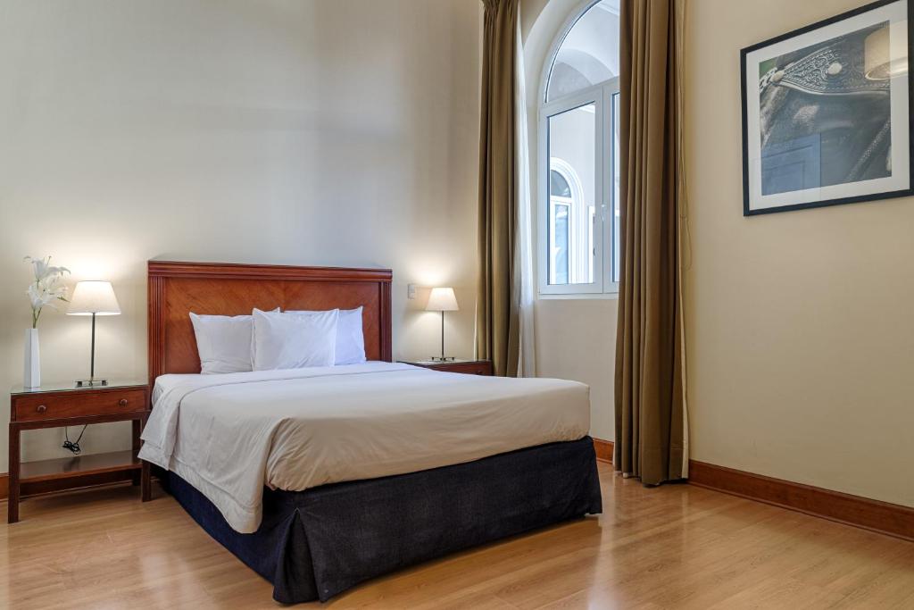 Postel nebo postele na pokoji v ubytování LP Los Portales Hotel Piura