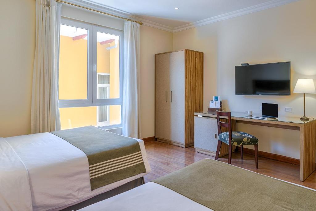 Postel nebo postele na pokoji v ubytování LP Los Portales Hotel Piura