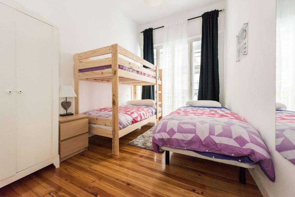 Postel nebo postele na pokoji v ubytování M&F Gran Via 3 Hab
