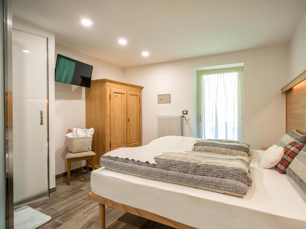 Postel nebo postele na pokoji v ubytování Albergo Panorama
