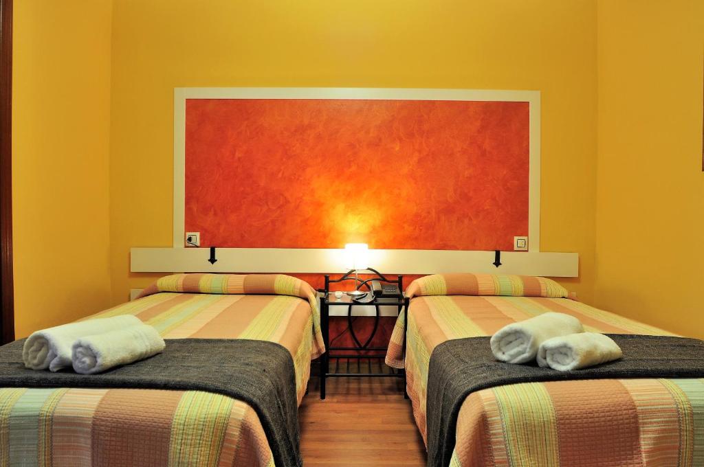 Postel nebo postele na pokoji v ubytování Hostal Europa