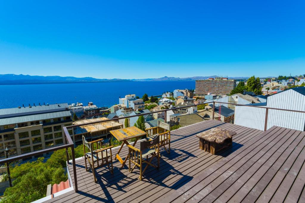 a view from a balcony overlooking the ocean at Hostel Inn Bariloche in San Carlos de Bariloche