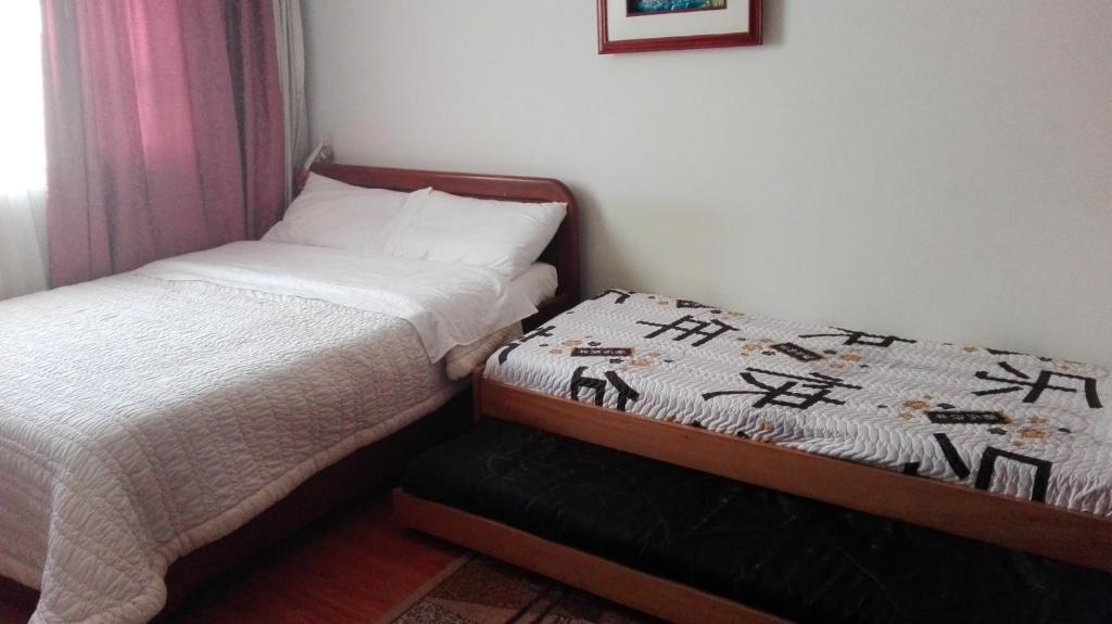 Postel nebo postele na pokoji v ubytování D'lujo