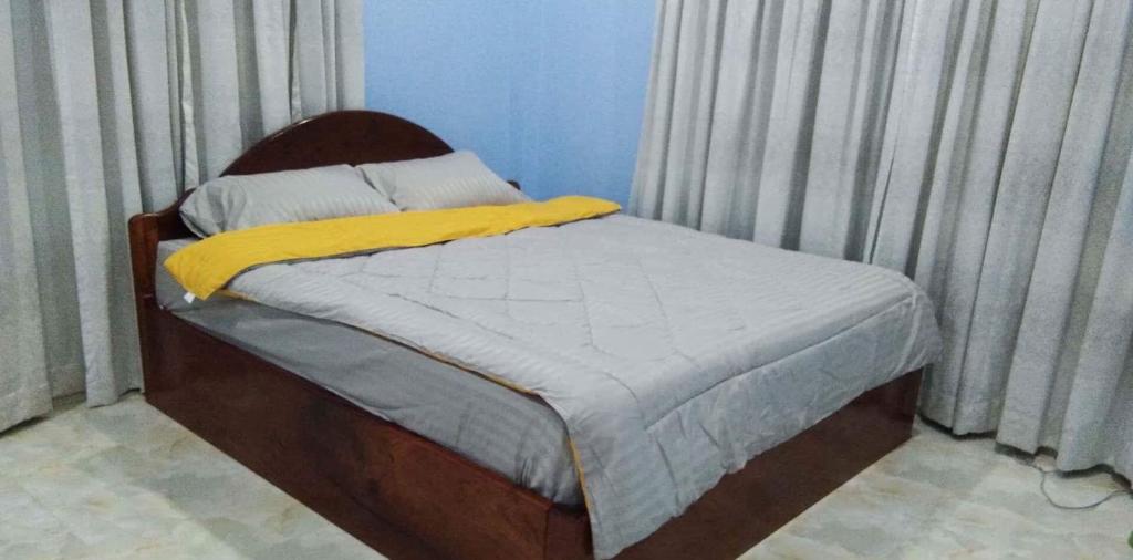 Postel nebo postele na pokoji v ubytování Bunyong Homestay