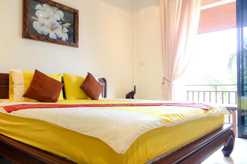 Postel nebo postele na pokoji v ubytování Thai Pura Resort