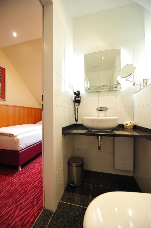 Postel nebo postele na pokoji v ubytování Frühlings-Hotel