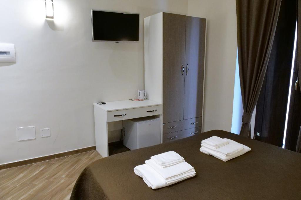 Posteľ alebo postele v izbe v ubytovaní B&B Il Campanile