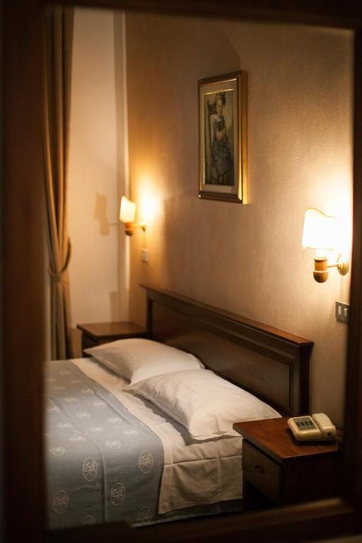 Postel nebo postele na pokoji v ubytování Hotel Giardino