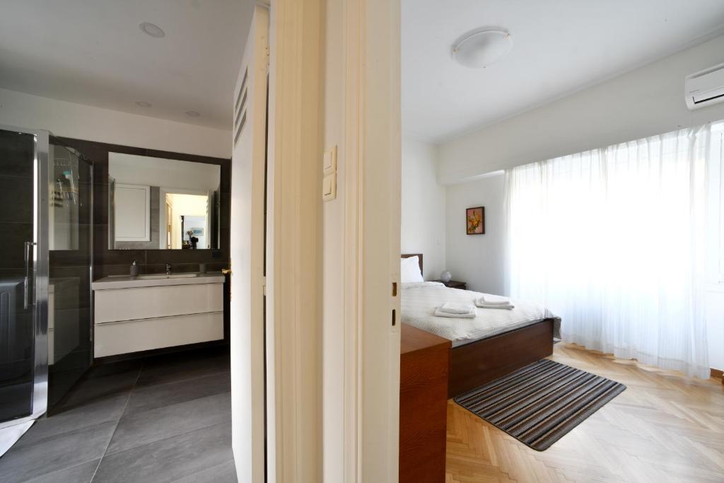 Posteľ alebo postele v izbe v ubytovaní Athens Squared Apartments