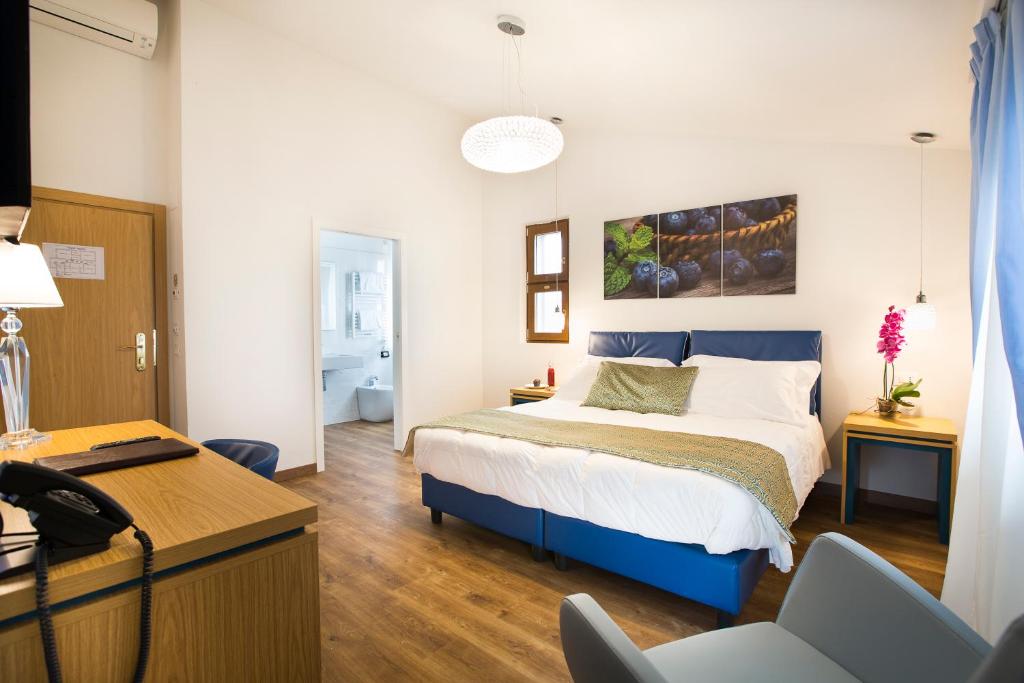 Postel nebo postele na pokoji v ubytování La Gustea Hotel & Cucina