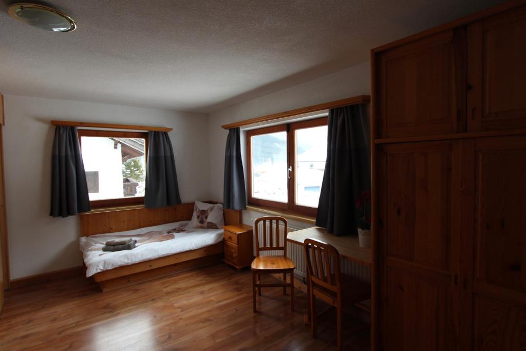 Postel nebo postele na pokoji v ubytování Alpenhaus Bichlbach